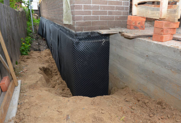 SJ Waterproofing Pros technician performing targeted Foundation Crack Repair assessment in Oxford, KS